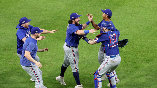 Oct 23, 2023; Houston, Texas, USA; Texas Rangers catcher Austin Hedges (11), pitcher Jose Leclerc (25) and catcher Jonah Heim (28) celebrate after winning game seven in the ALCS against the Houston Astros for the 2023 MLB playoffs at Minute Maid Park. Mandatory Credit: Troy Taormina-USA TODAY Sports  